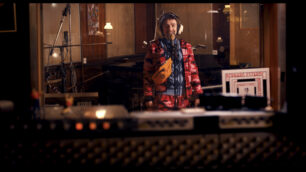 Sasha (singer) waiting for sound engineer Jeff to record his song "Draped In A Dragon"