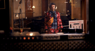 Sasha (singer) waiting for sound engineer Jeff to record his song "Draped In A Dragon"